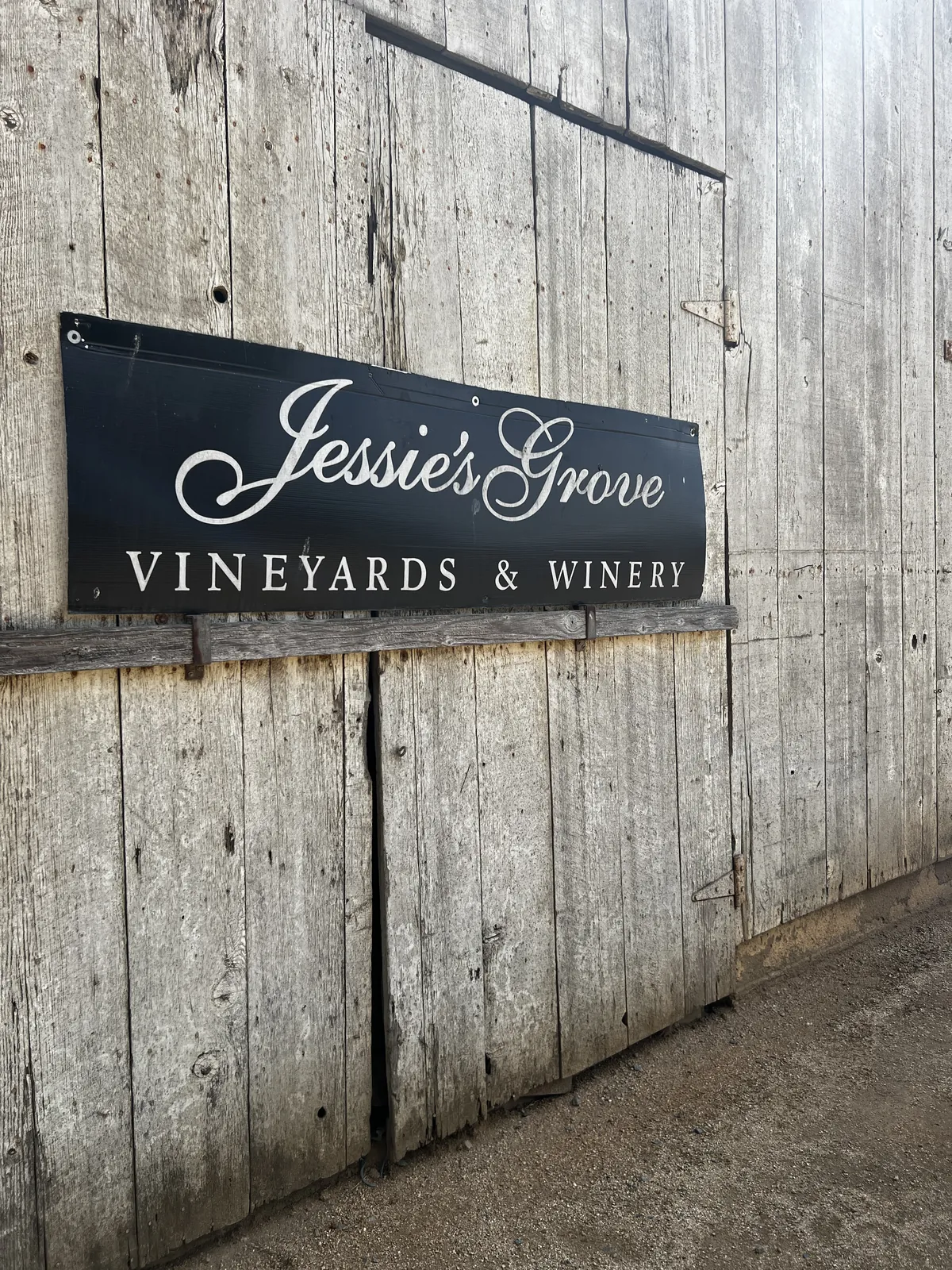 Gen X UGC creator's product photography featuring a shot of the Jessie's Grove Winery barn in Lodi, CA.